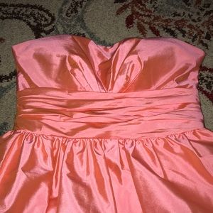 a short sleeveless coral prom dress
